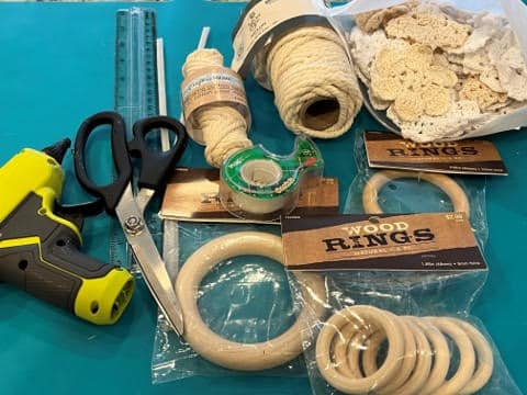 1.89 “ Wood Rings (Hobby Lobby #1522820) This size is used for small bunny head 2.95 “ Wood Rings (Hobby Lobby #1522853) This size is used for small bunny body and large bunny head) 3.81 “ Wood Rings (Hobby Lobby #1886092) This size is used for large bunny body 5mm Yarn Bee Macramé Rope in Natural (Hobby Lobby #2170553) I used this macramé  for the  large bunny 4mm Crafters Square Macramé Cotton Twine (Dollar Tree) I used this macramé for the small bunny White Chenille Pipe Cleaners 1” Pom Pom for small bunny 2” Pom Pom for large bunny Small Doilies or Lace (optional) Scissors Tape Pencil Ruler or Measuring Tape Glue Gun and Glue Sticks